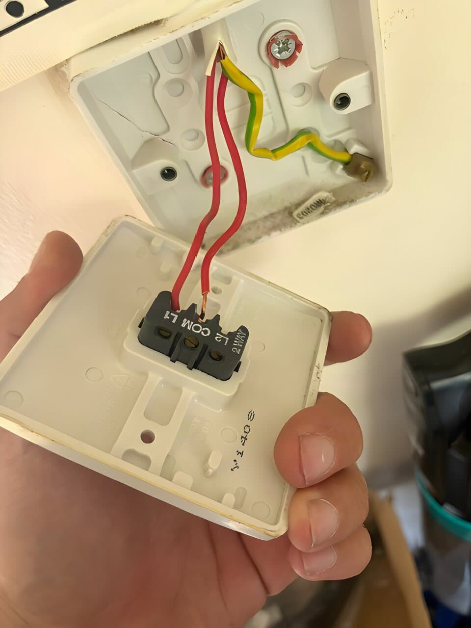 Light switch plate being wired in