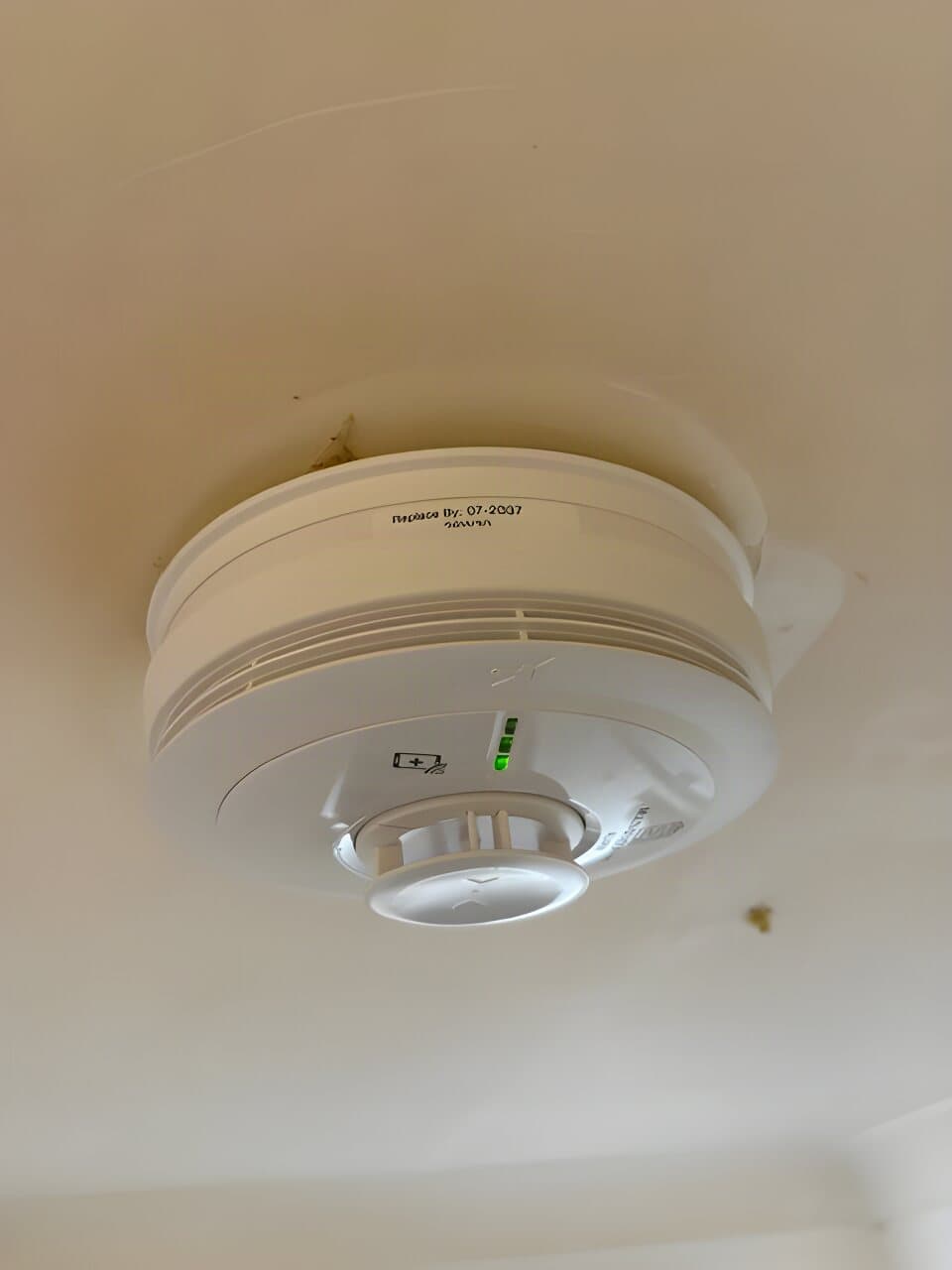 Mains-wired alarm fitted to a kitchen ceiling